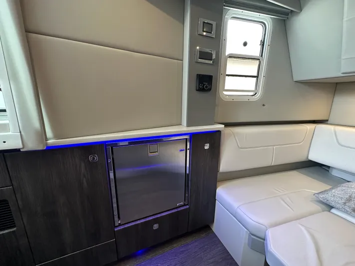  Yacht Photos Pics Interior of 2021 Formula 380 SSC yacht with modern seating and mini fridge.