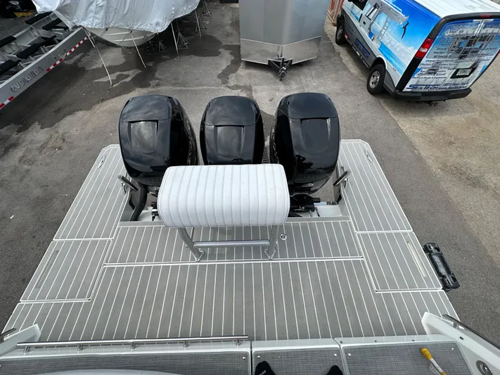  Yacht Photos Pics 2021 Formula 380 SSC boat with triple outboard engines, rear deck view.