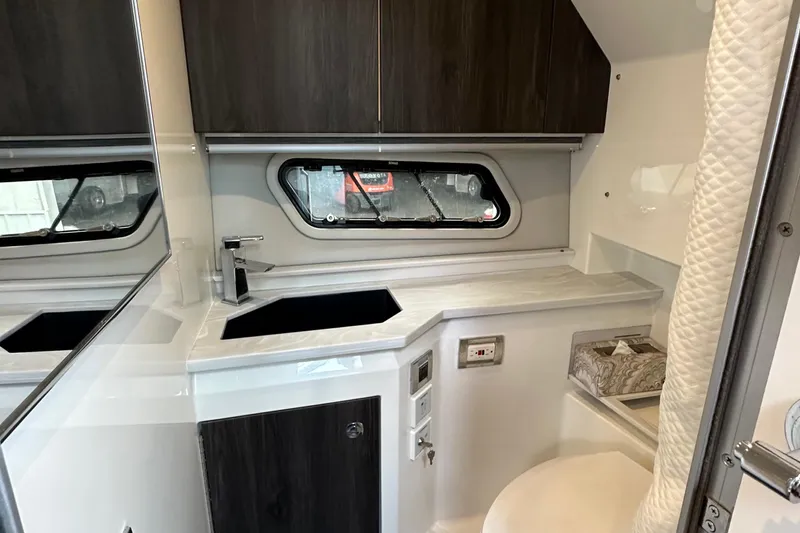  Yacht Photos Pics 2021 Formula 380 SSC boat interior with modern kitchenette and window.
