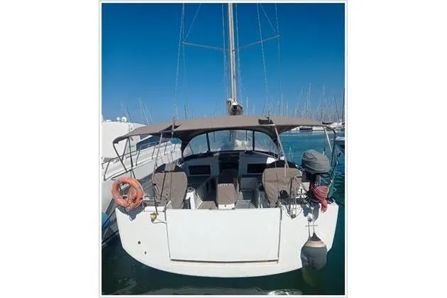  Yacht Photos Pics Jeanneau Sun Odyssey 490 sailboat, 2020 model, docked in a marina, rear view.