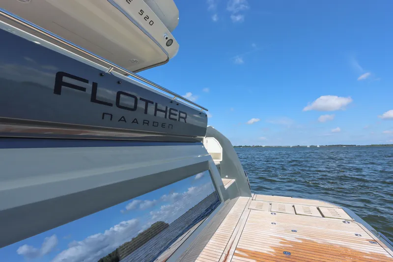  Yacht Photos Pics Luxury Prestige 520 yacht on open water, 2021 model, clear blue sky.