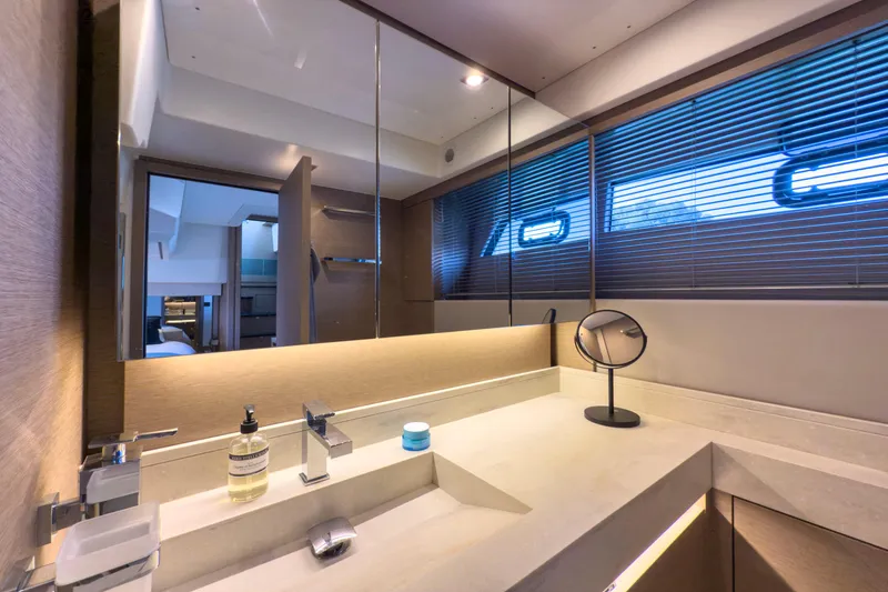  Yacht Photos Pics Luxurious bathroom interior of 2021 Prestige 520 yacht with modern fixtures and ambient lighting.