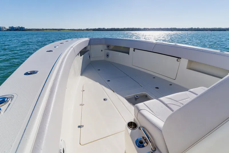  Yacht Photos Pics 2012 SeaVee 390B boat deck with seating, cruising on calm waters under clear skies.