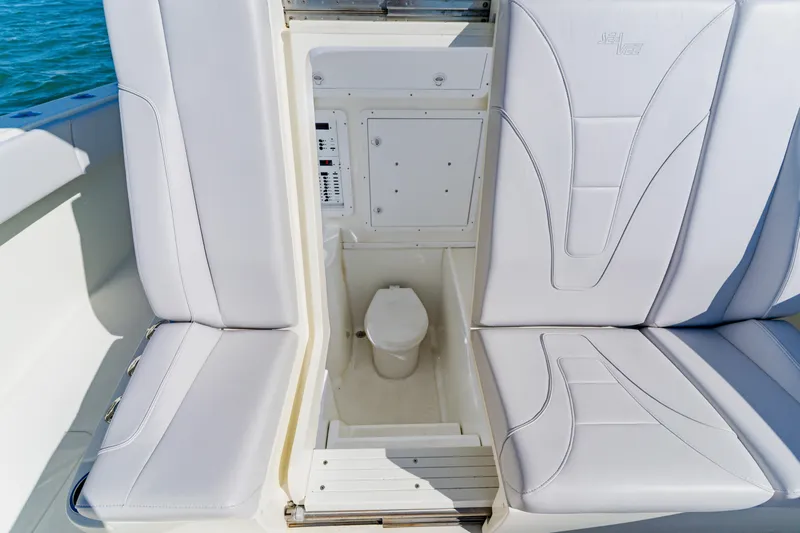  Yacht Photos Pics 2012 SeaVee 390B boat interior with hidden marine toilet under cushioned seating.