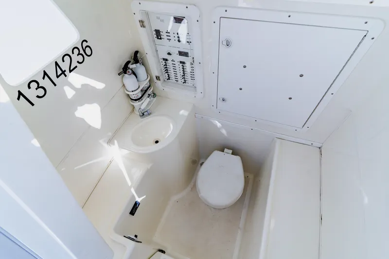  Yacht Photos Pics 2012 SeaVee 390B boat interior with toilet, sink, and control panel.