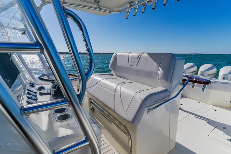  Yacht Photos Pics 2012 SeaVee 390B boat interior with helm, seating, and ocean view.