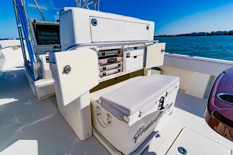  Yacht Photos Pics 2012 SeaVee 390B boat with open storage compartments and cooler on deck.
