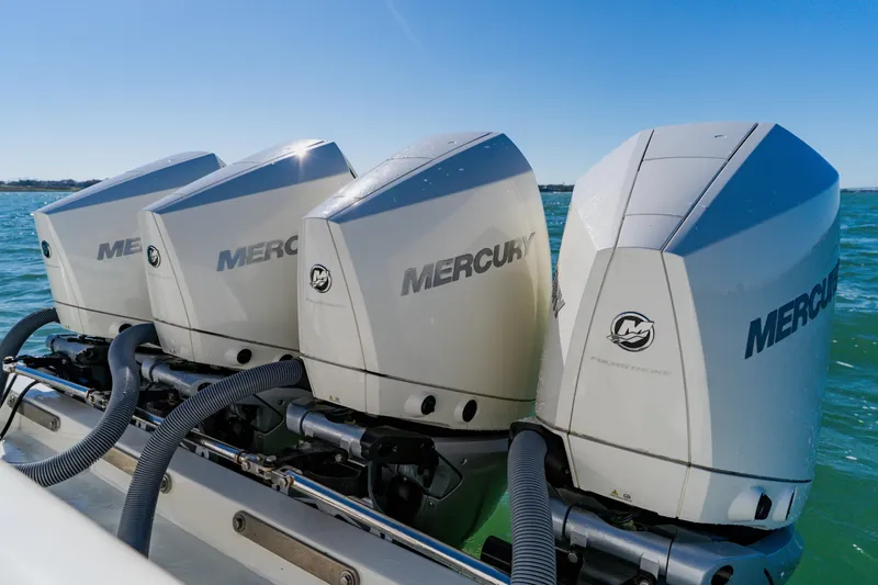  Yacht Photos Pics Triple Mercury outboard engines on a 2012 SeaVee 390B boat in open water.