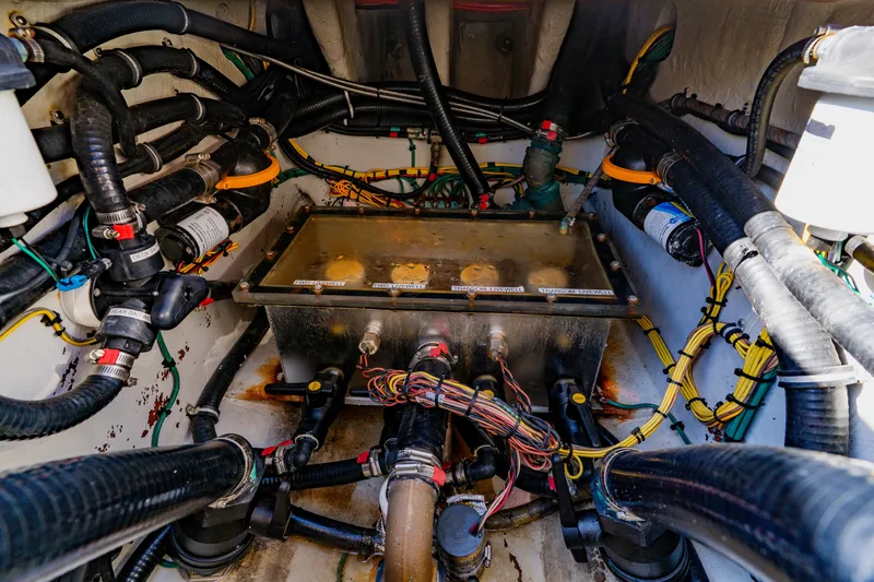  Yacht Photos Pics Engine compartment of 2012 SeaVee 390B boat, showcasing wiring and mechanical components.