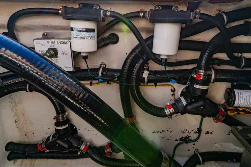  Yacht Photos Pics Engine compartment of 2012 SeaVee 390B boat, showing fuel filters and hoses.