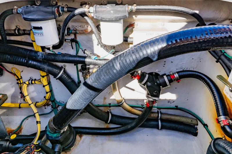  Yacht Photos Pics Engine compartment of 2012 SeaVee 390B boat with hoses and filters visible.