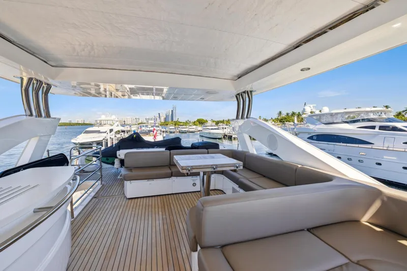  Yacht Photos Pics Luxurious 2014 Sunseeker 73 Manhattan yacht interior with spacious seating and scenic marina view.