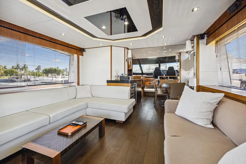  Yacht Photos Pics Luxurious interior of 2014 Sunseeker 73 Manhattan yacht with modern furnishings and panoramic windows.