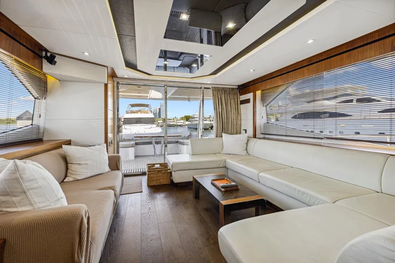 Yacht Photos Pics Luxurious interior of 2014 Sunseeker 73 Manhattan yacht with elegant seating and modern design.