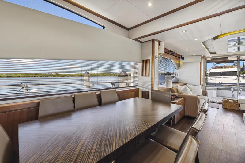  Yacht Photos Pics Luxurious interior of 2014 Sunseeker 73 Manhattan yacht with elegant dining area.