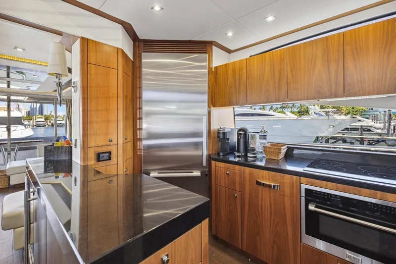  Yacht Photos Pics Luxurious kitchen interior of 2014 Sunseeker 73 Manhattan yacht with modern appliances.