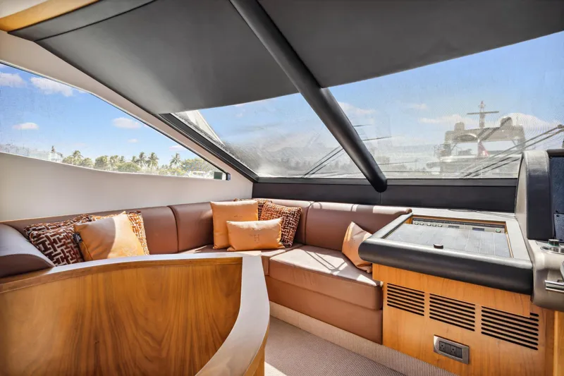  Yacht Photos Pics Luxurious interior of 2014 Sunseeker 73 Manhattan yacht with plush seating and panoramic windows.