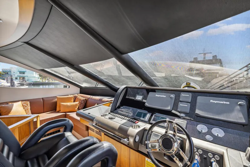  Yacht Photos Pics Luxurious 2014 Sunseeker 73 Manhattan yacht interior with modern helm and plush seating.
