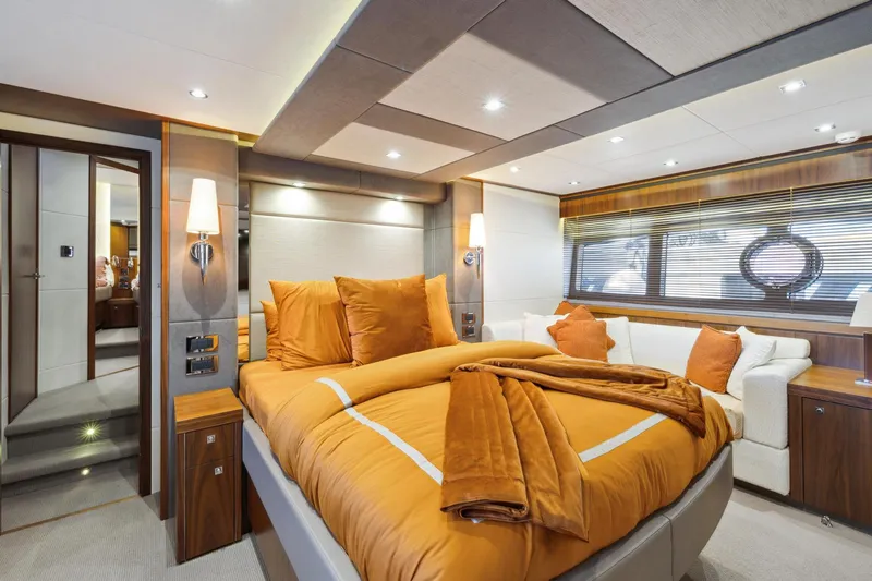  Yacht Photos Pics Luxurious bedroom interior of 2014 Sunseeker 73 Manhattan yacht with elegant decor.