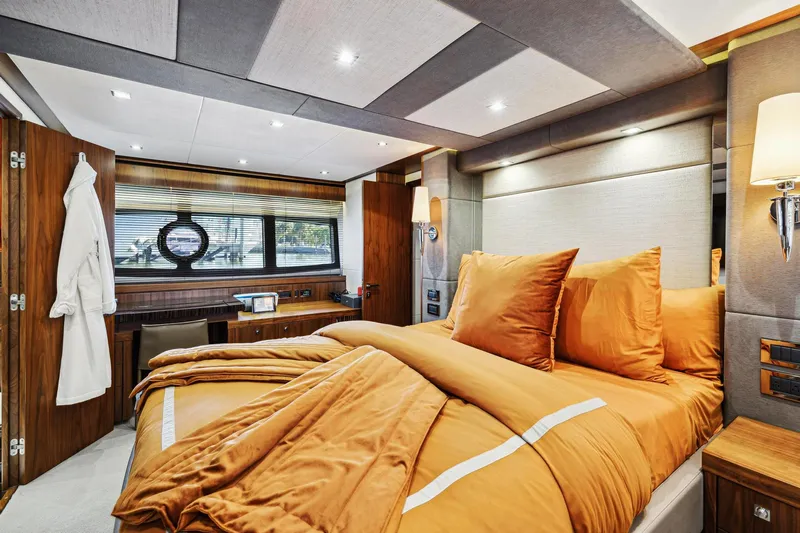  Yacht Photos Pics Luxurious bedroom interior of 2014 Sunseeker 73 Manhattan yacht with elegant decor.
