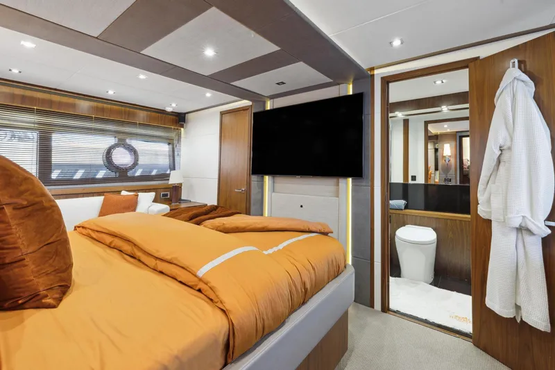  Yacht Photos Pics Luxurious bedroom interior of 2014 Sunseeker 73 Manhattan yacht with ensuite bathroom.