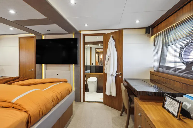 Yacht Photos Pics Luxurious 2014 Sunseeker 73 Manhattan yacht bedroom with modern decor and ensuite bathroom.
