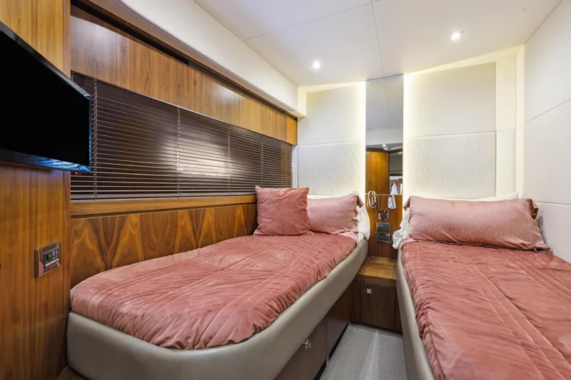  Yacht Photos Pics Luxurious twin bedroom in 2014 Sunseeker 73 Manhattan yacht with elegant wood paneling.
