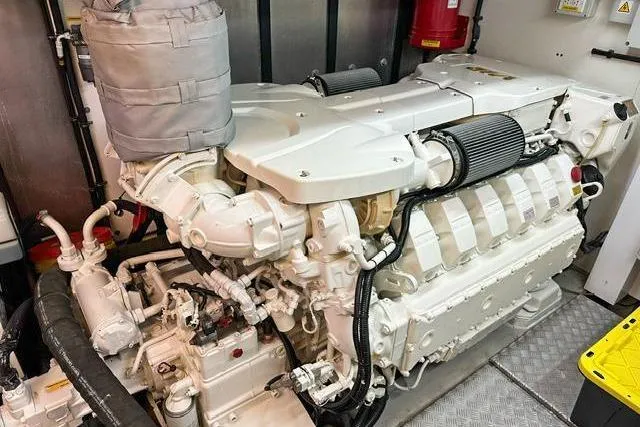  Yacht Photos Pics Engine room of 2014 Sunseeker 73 Manhattan yacht, showcasing powerful marine engine components.