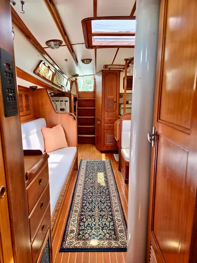 Circa Tempo Yacht Photos Pics Interior of a 1991 Mason 44 yacht with wooden finishes and elegant decor.