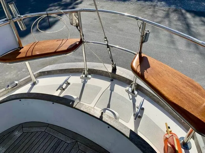 Circa Tempo Yacht Photos Pics Sailing yacht deck with wooden seats, Mason 44, 1991 model.