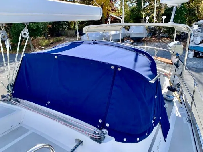 Circa Tempo Yacht Photos Pics Sailboat with blue canvas cover, Mason 44 model, 1991, docked outdoors.