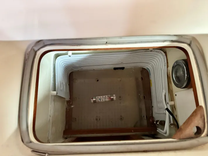 Circa Tempo Yacht Photos Pics Interior of a Mason 44 refrigerator, 1991 model, showing cooling coils and light.