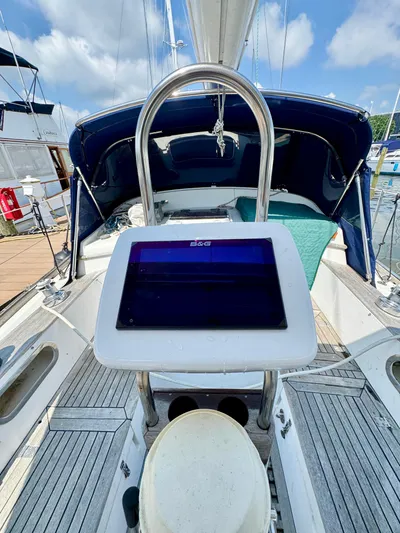 Circa Tempo Yacht Photos Pics Sailboat cockpit with navigation equipment, Mason 44 model, 1991, docked under blue sky.