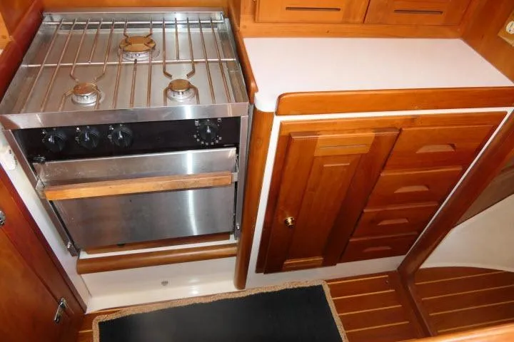 C Otter Yacht Photos Pics Wooden yacht kitchen with stainless steel stove, Tartan 3700, 2002 model.