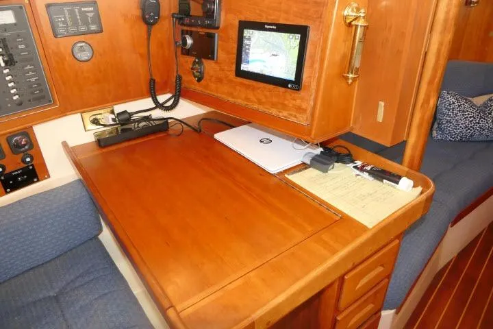 C Otter Yacht Photos Pics Navigation station in 2002 Tartan 3700 sailboat with chart plotter and communication equipment.