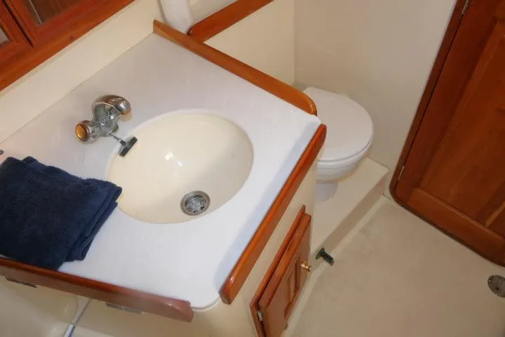 C Otter Yacht Photos Pics Bathroom interior of 2002 Tartan 3700 yacht with sink and toilet.