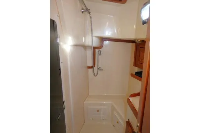 C Otter Yacht Photos Pics Compact bathroom in 2002 Tartan 3700 yacht with shower and wooden accents.