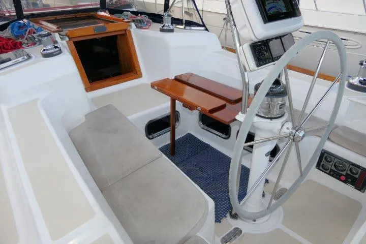C Otter Yacht Photos Pics Cockpit of 2002 Tartan 3700 sailboat with steering wheel and seating area.