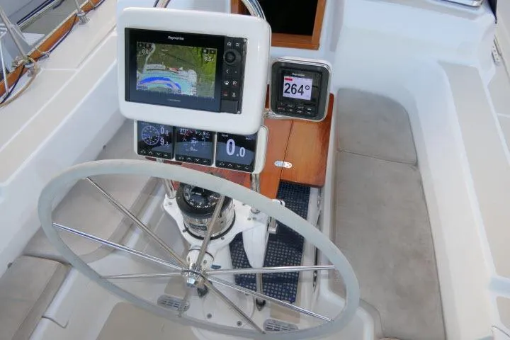 C Otter Yacht Photos Pics Steering wheel and navigation instruments on a 2002 Tartan 3700 sailboat.