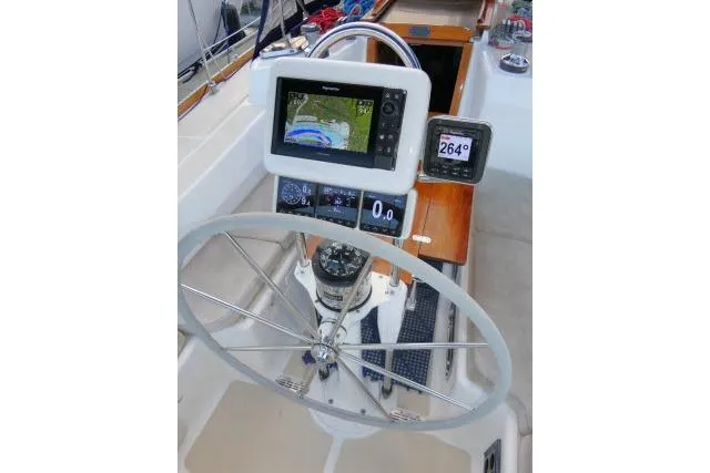 C Otter Yacht Photos Pics Steering wheel and navigation system on a 2002 Tartan 3700 sailboat.