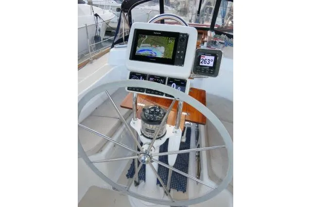 C Otter Yacht Photos Pics Steering wheel and navigation equipment on a 2002 Tartan 3700 sailboat.