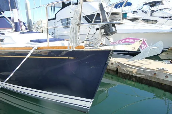 C Otter Yacht Photos Pics Sailboat Tartan 3700, 2002 model, docked in marina with visible anchor.