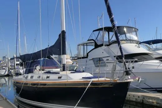 C Otter Yacht Photos Pics 2002 Tartan 3700 sailboat docked at marina under clear blue sky.
