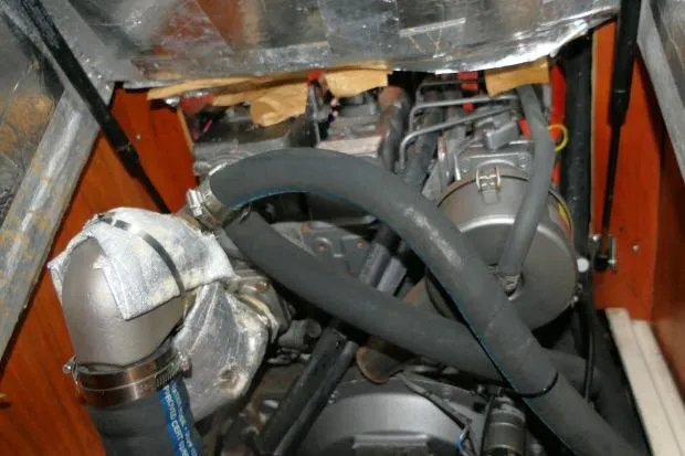 C Otter Yacht Photos Pics Engine compartment of a 2002 Tartan 3700 sailboat, featuring hoses and mechanical components.