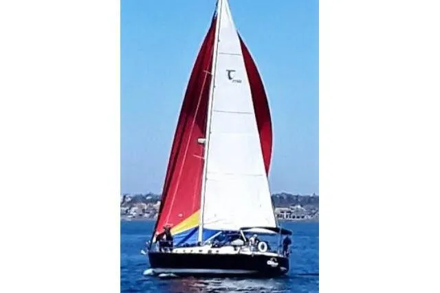 C Otter Yacht Photos Pics Sailboat Tartan 3700, 2002 model, with red and white sails on open water.