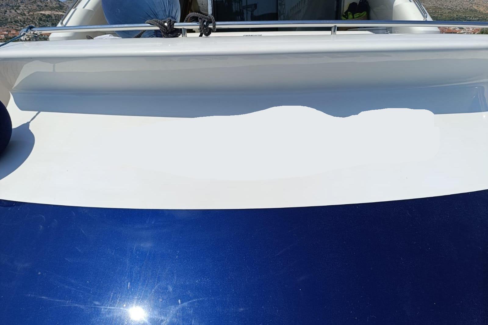 2005 Pershing 76 yacht deck with sleek white and blue design.