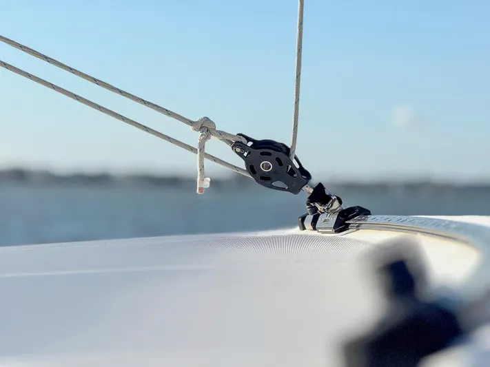 Blue Pearl Too Yacht Photos Pics Close-up of rigging on a 2017 Lagoon 42 catamaran against a blurred seascape.