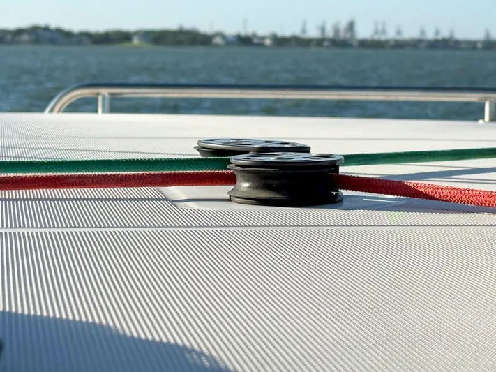 Blue Pearl Too Yacht Photos Pics Close-up of deck fittings on a 2017 Lagoon 42 catamaran with colorful ropes.