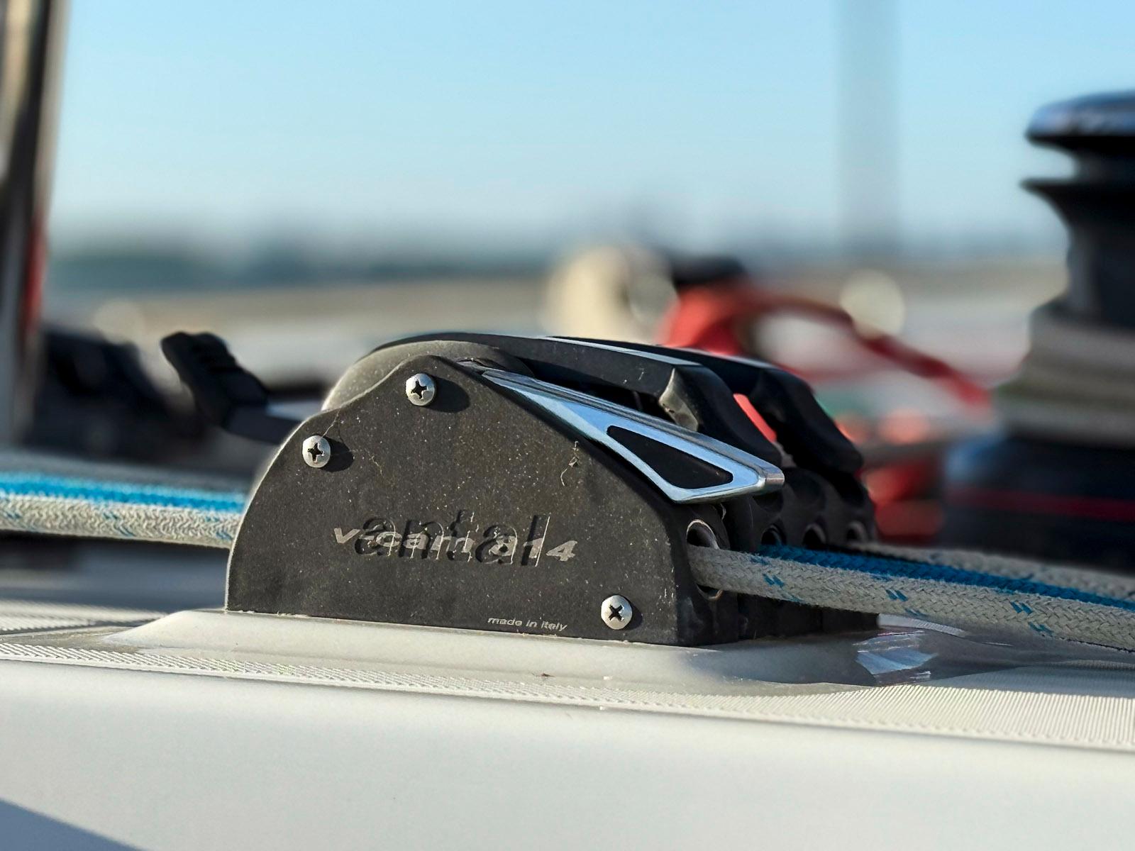 Close-up of a 2017 Lagoon 42 sailboat's rope cleat mechanism on deck.