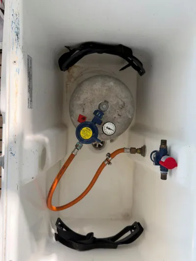 Blue Pearl Too Yacht Photos Pics Propane tank setup in a 2017 Lagoon 42 boat compartment.